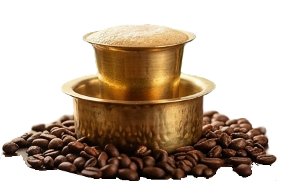 Traditional brass davara-tumbler filter coffee, freshly brewed and steaming, over Chikmagalur coffee beans